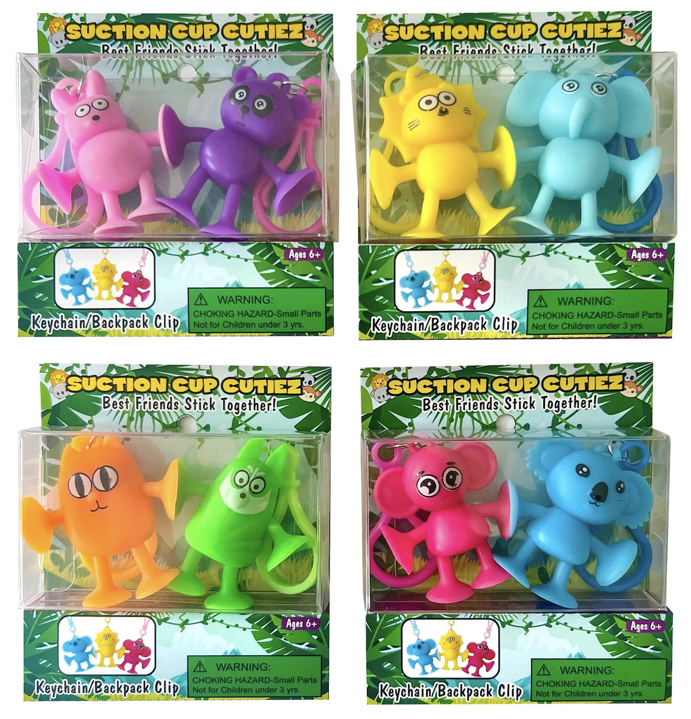 Assortment of Suction Cup Cutiez in clear boxes to show the colors available. Choose between pink and purple, yellow and blue, green and orange, or hot pink and blue. 