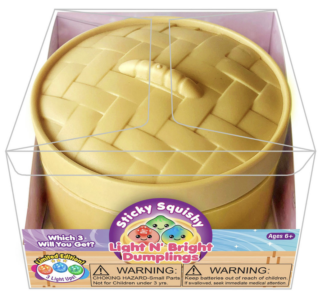 A steamer basket inspired box packaged in a clear plastic box with a colorful label with illustrations of the Light N' Bright Dumplings that are inside. 