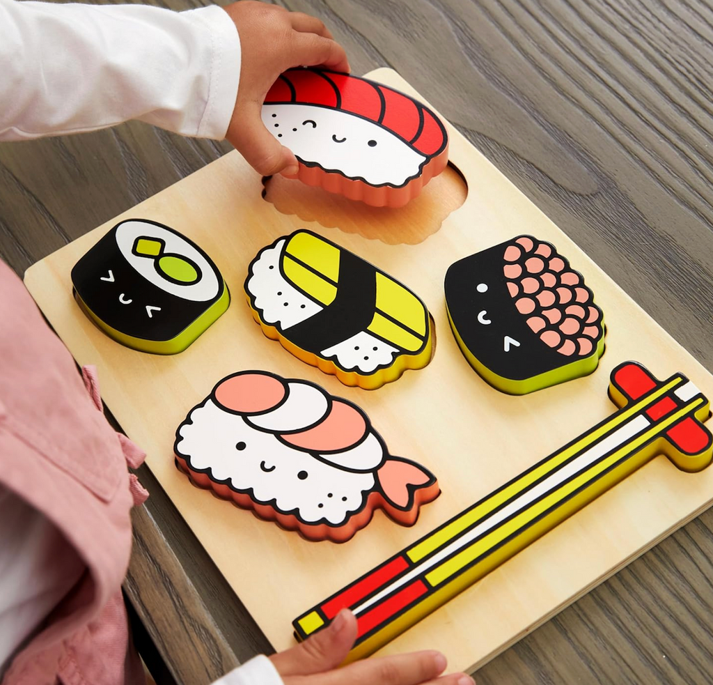 Sushi Friends Wooden Tray Puzzle with one of the chunky pieces lifted out. 