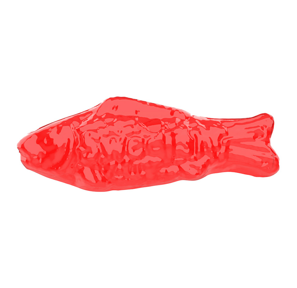 Close up of the red Swedish fish squish toy. 