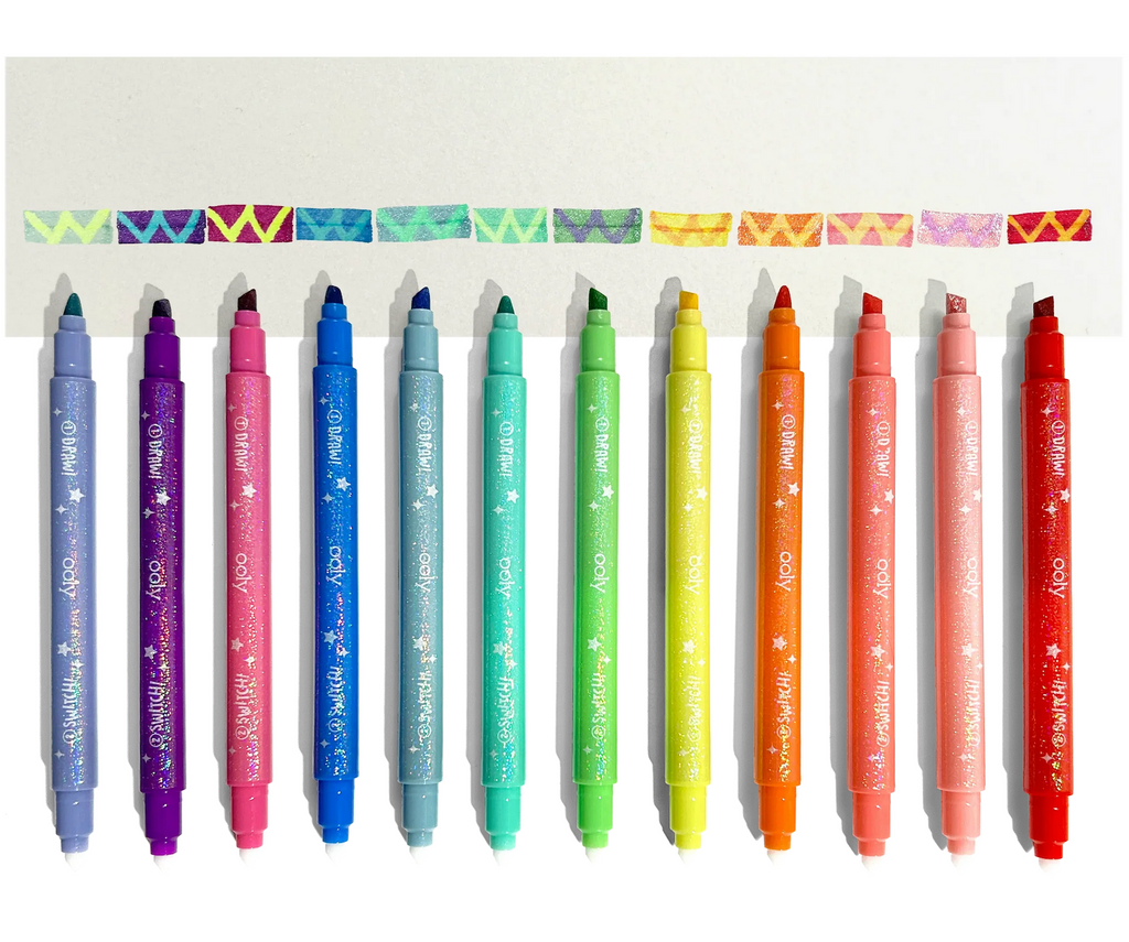 Switch-Eroo Sparkle Markers lined up underneath a color swatch that shows their color as well as the mystery color that can be drawn with it. 