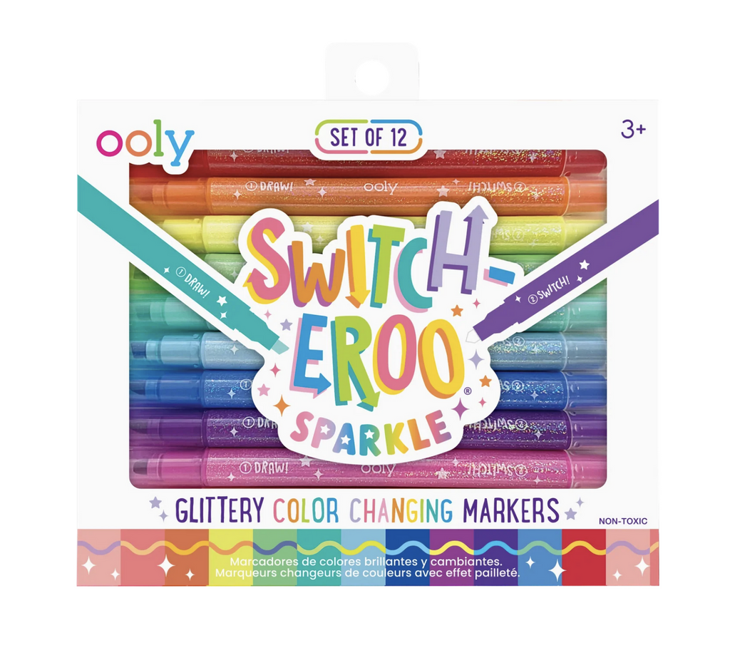White box with colorful lettering that reads "Switch-eroo Sparkle" and has a clear window that shows the set of 12 color changing markers with glittery barrels. 