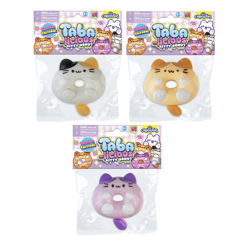 Assorted styles of the Taba-Licious Kitty Donut packaged in clear plastic with purple header cards that read "Taba-Licious Kitty Donut" 