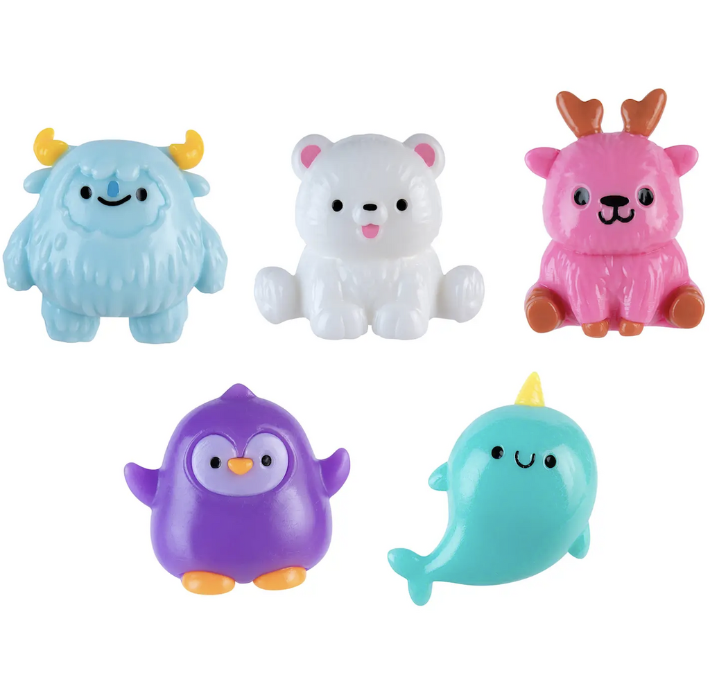 Assorted Taba-Licious Polar Pals squishy toys in shapes like a yeti, polar bear, pink reindeer, purple penguin, and a narwhal. 