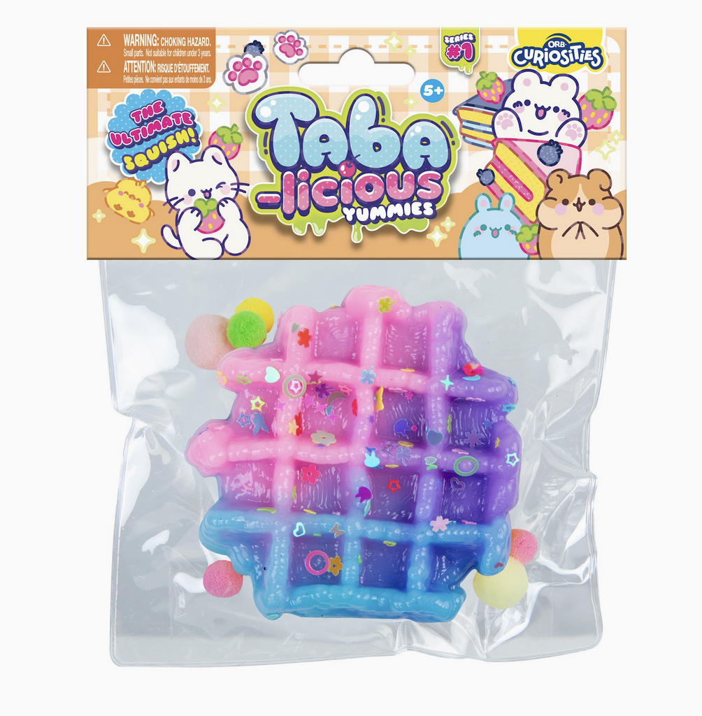 Taba-Licious Yummies in the form of a pink, purple and blue waffle, packaged in a clear bag with an illustrated header with  cute animals and food. Not food, do not eat. 