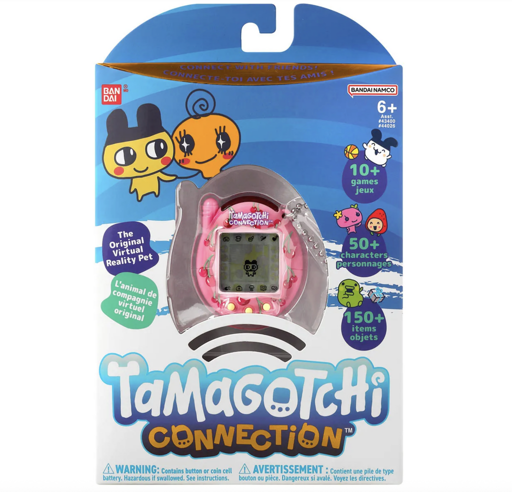 Blue and white box with illustrated graphics of Tamagotchi characters and a clear window showing the Tamagotchi Connection with a Cherry themed shell. 