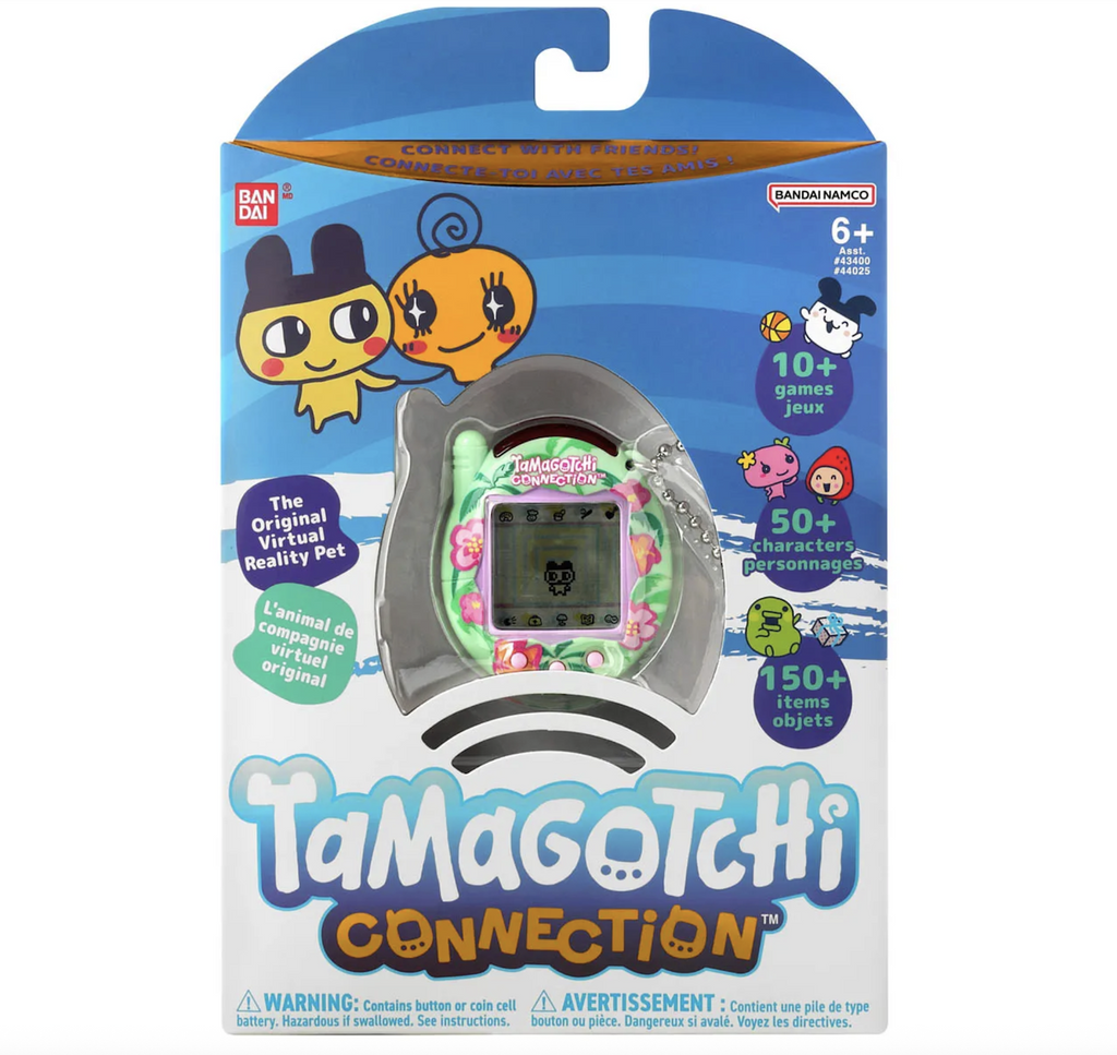 Blue and white box illustrated with Tamagotchi characters from the Original Virtual Reality Pet and a clear winow in the center of the box the shows the Tropical Flowers themed shell. 