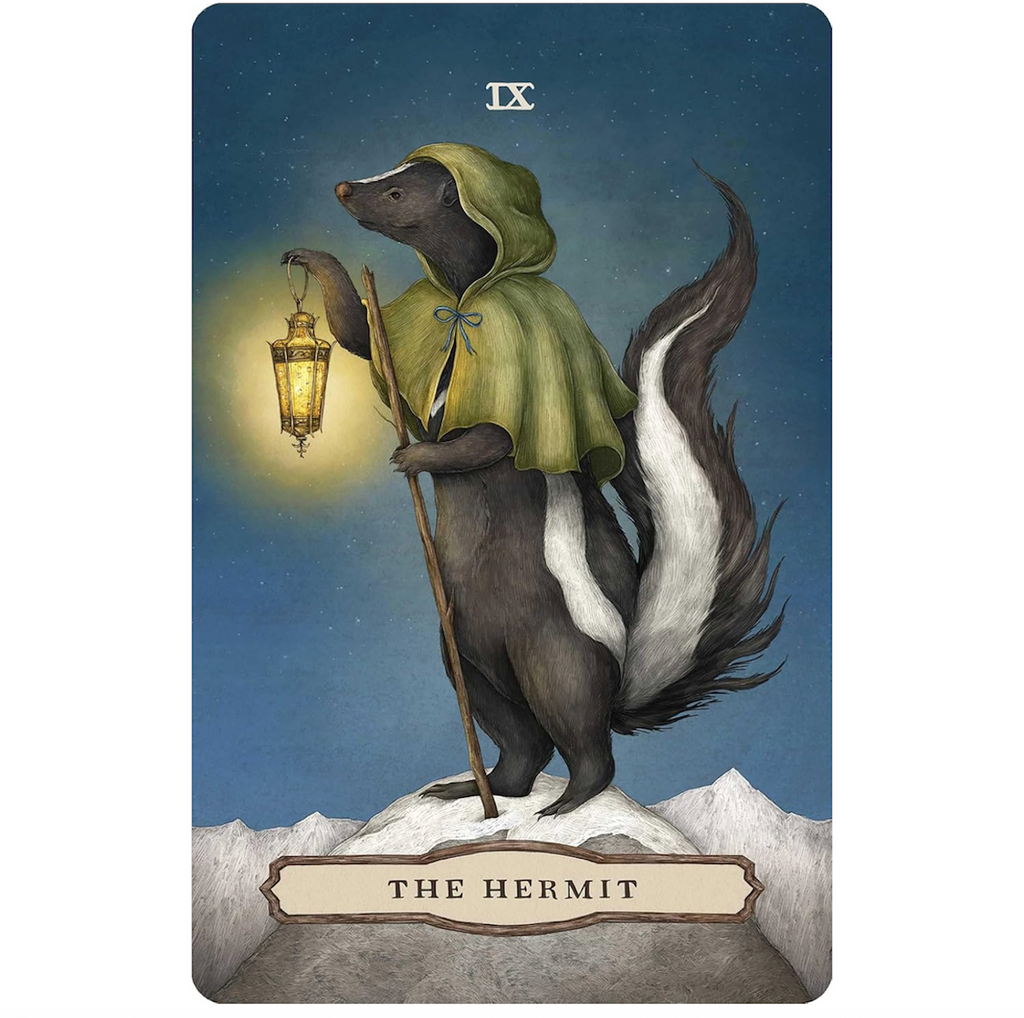 Tarot card featuring a badger in a green hood with a lantern, titled 'The Hermit' from the Tarot of the Woodland Wardens deck. 
