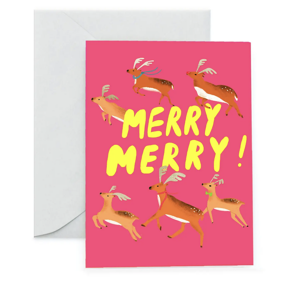 A bright pink greeting card with reindeer illustrated on the cover that reads "Merry, Merry"