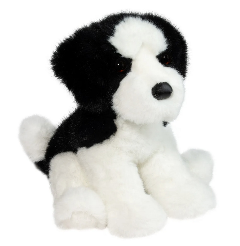 Black and white Shih Tzu plush dog in a sitting position. 
