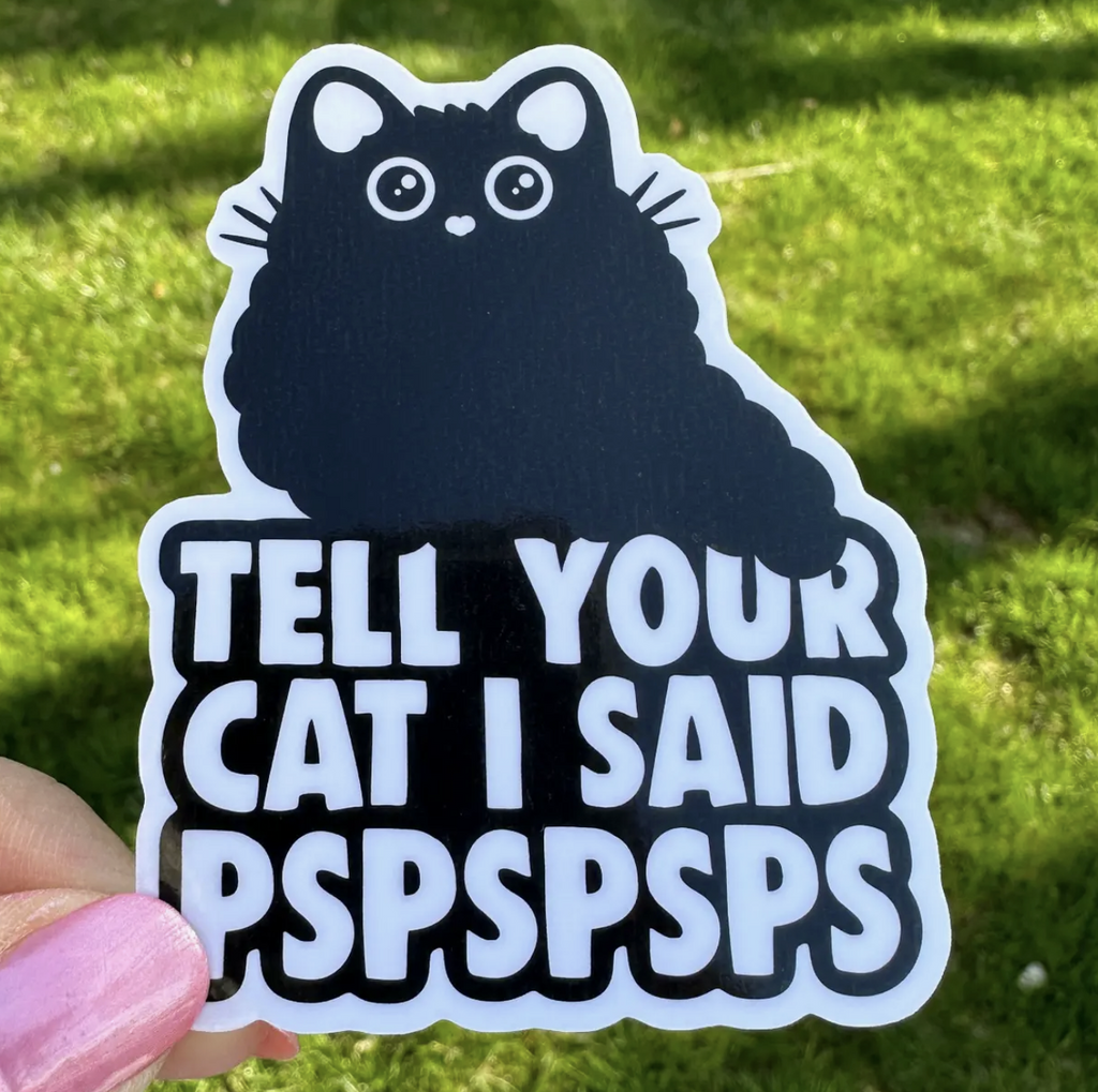 Vinyl sticker with an illustration of a cute black cat with bubble lettering that reads "Tell Your Cat I Said PSPSPSPSPSPS" 