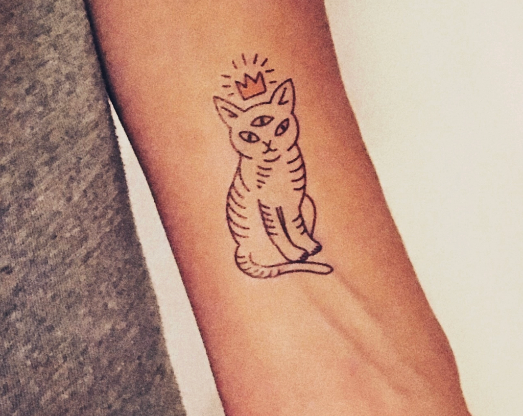 One of the temporary tattoos from the Kitty Cats sheet applied to the skin. 