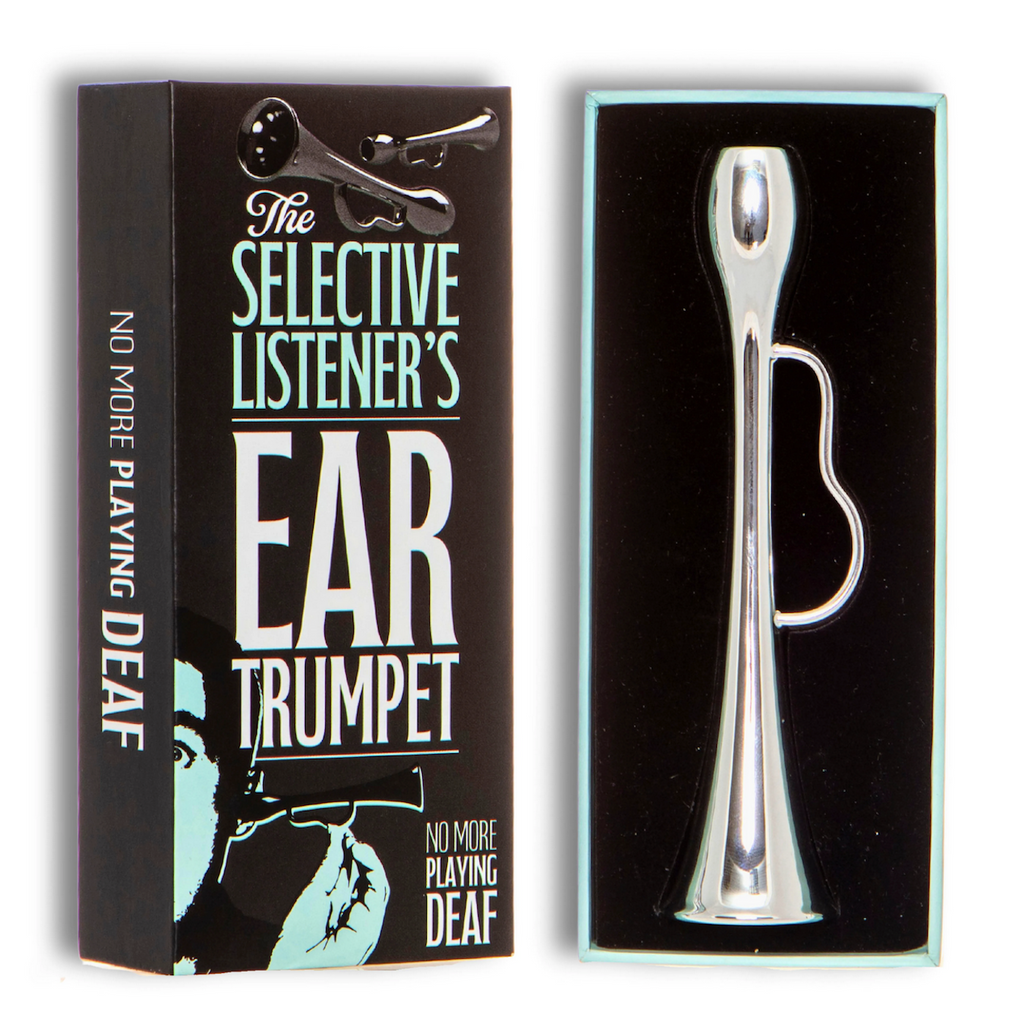 Box top for The Selective Listener's Ear Trumpet with oversize lettering and the silver Ear Trumpet encased on soft, black velvet inside the box. 