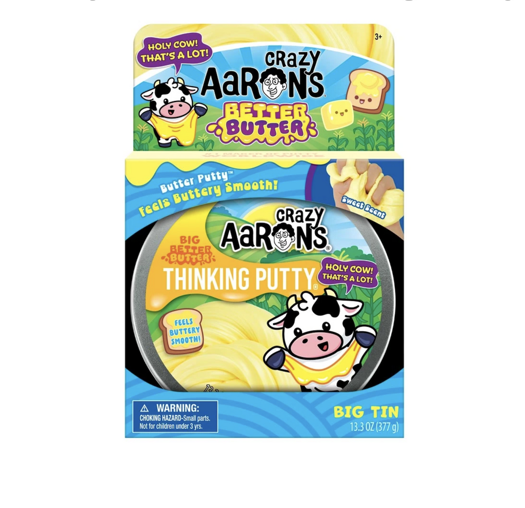 Crazy Aaron's Better Butter Mega Tin with a label featuring a cute cow playing with the buttery smooth putty. 