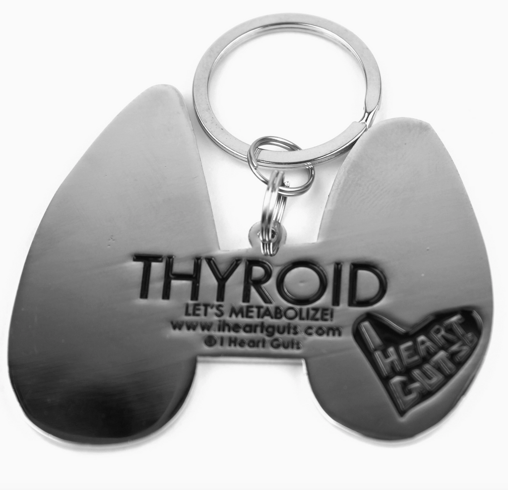 Back view of the Thyroid enamel keychain with Let's Metabolize written on the back.  
