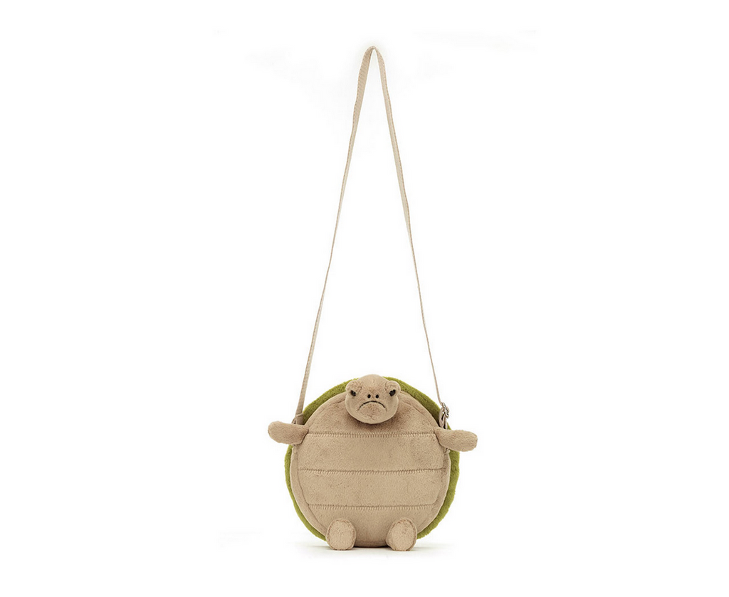 Plush turtle bag with strap fully extended.