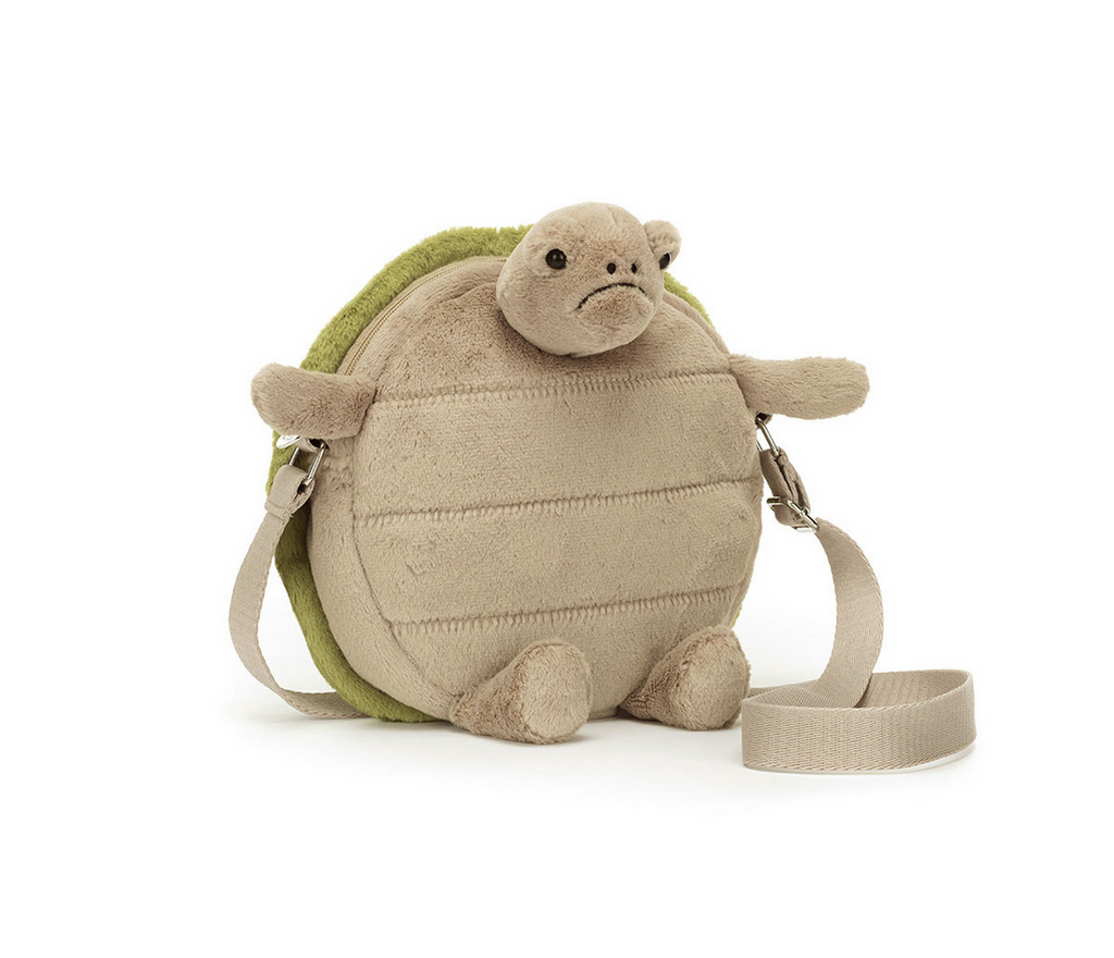 Plush turtle with a grumpy face bag.