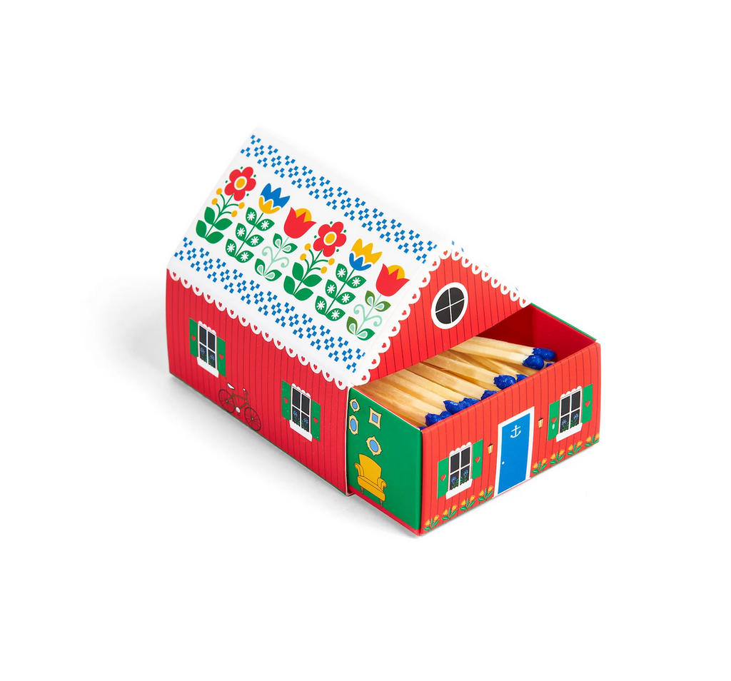 The adorable Tiny Living Red Matchbox Cottage filled with wooden matches. 