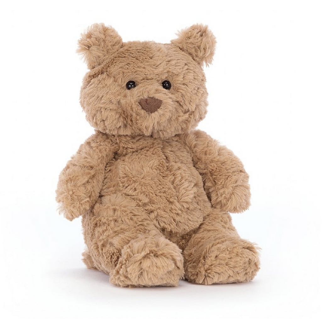Tiny plush brown bear sitting upright. Bartholomew Bear has soft light tan fur. 