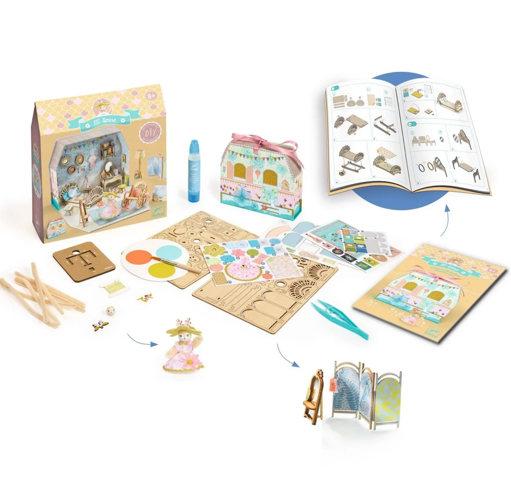 The Mi Alba House from Tinyly with all of the components included with the little house, wooden boards, stickers, paints and other supplies to complete this beginner model kit. 