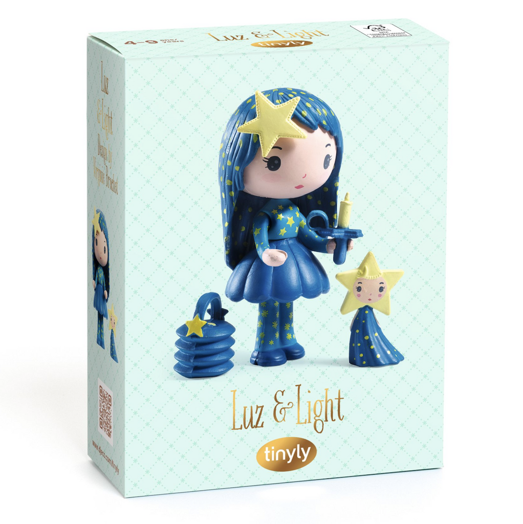 Blue patterned box with a picture of Luz holding a candle and her companion Light with the lantern accessory by her feet, pictured on the front. 