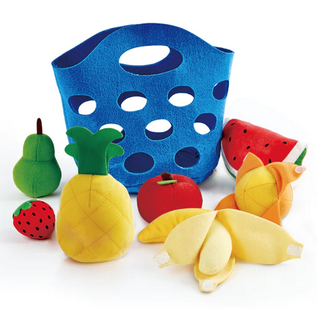 Blue basket with all the play food spread out around it. 