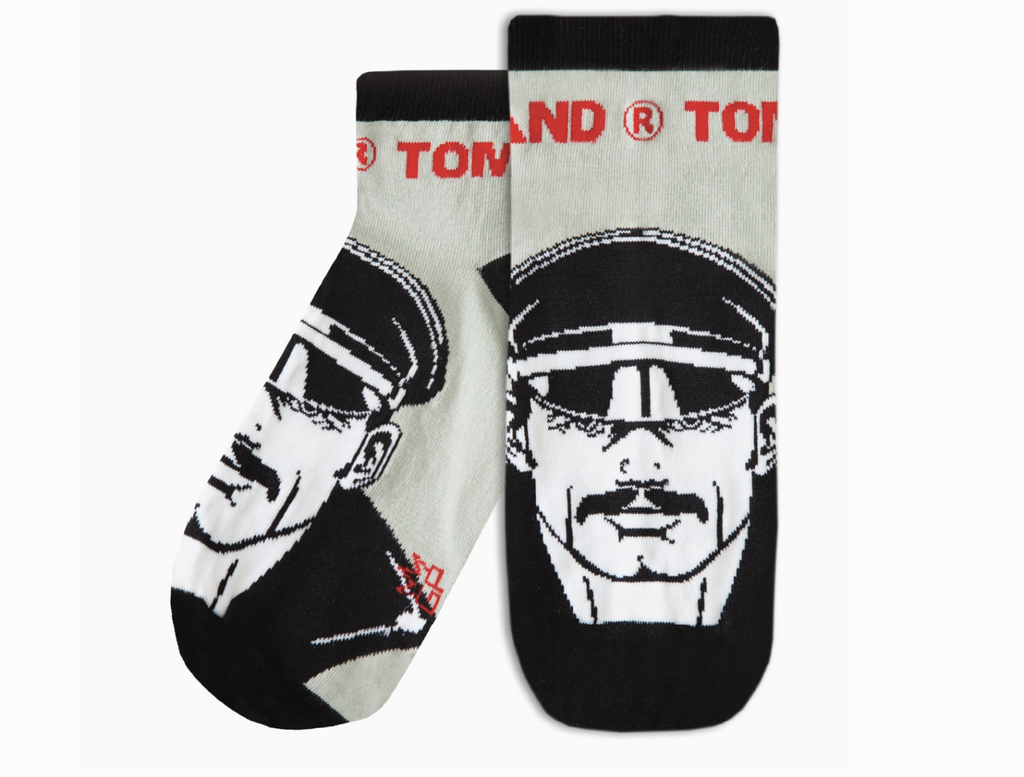 Tom of Finland 3/4 socks with an illustration of a hunky, beefcake wearing a leather cap. 