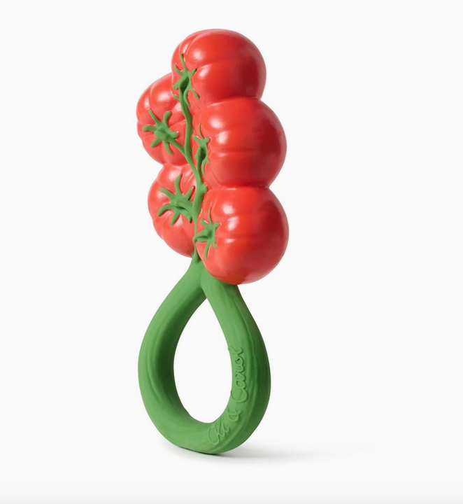 Side view of the Tomato Rattle Toy, the handle looks like a geen vine and the rattle looks like acluster of cherry tomatoes. 
