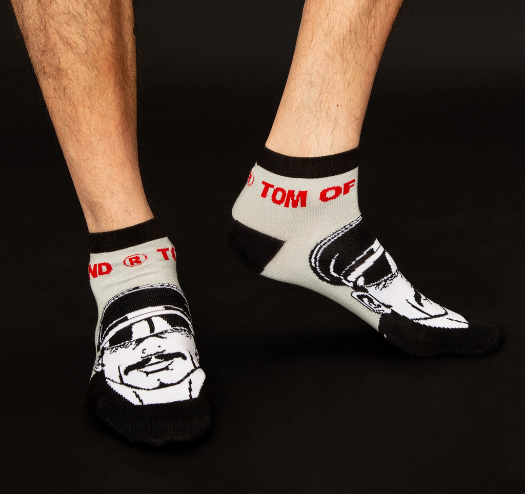 Tom of Finland 3/4 socks with an illustration of a hunky, beefcake wearing a leather cap. 