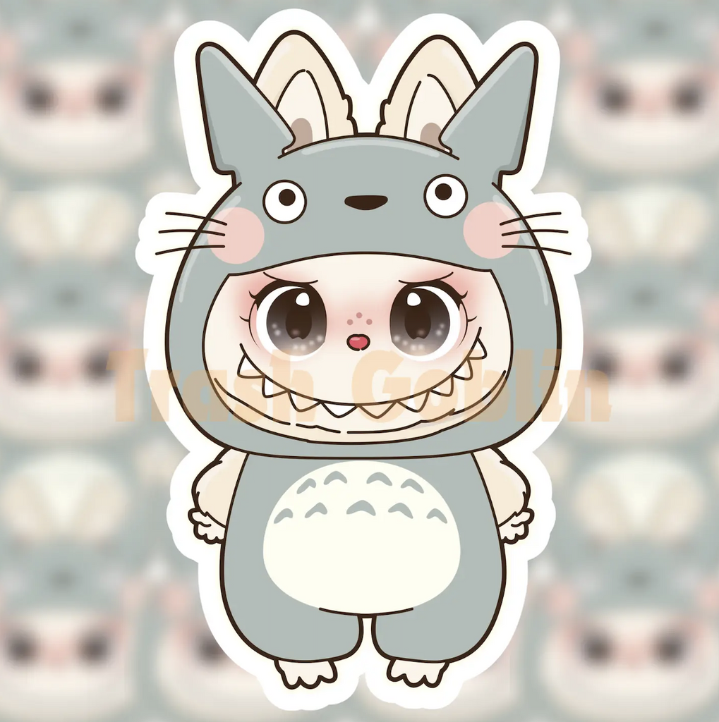 Labubu Totoro monster illustrated on a square vinyl sticker. Designed by Trash Goblin. 