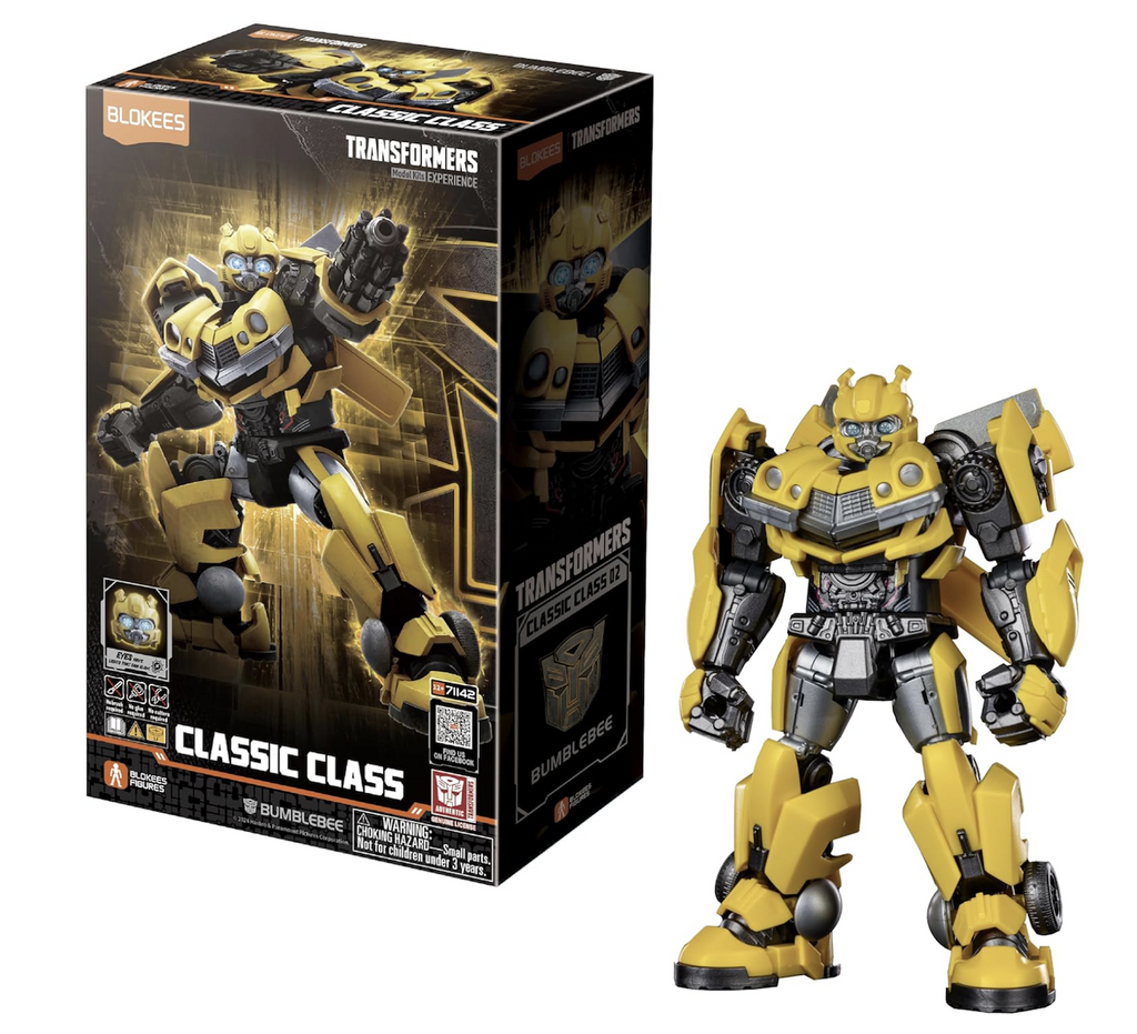 Transformers Bumblebee model figure standing beside the box that has a black background with a picture of the Bumblebee figure with an arm cannon outstretched. 