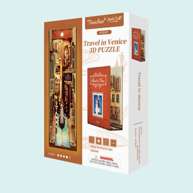 Travel in Venice 3D puzzle box with image of the completed puzzle which looks like you're looking down a quaint street in Venice Italy.