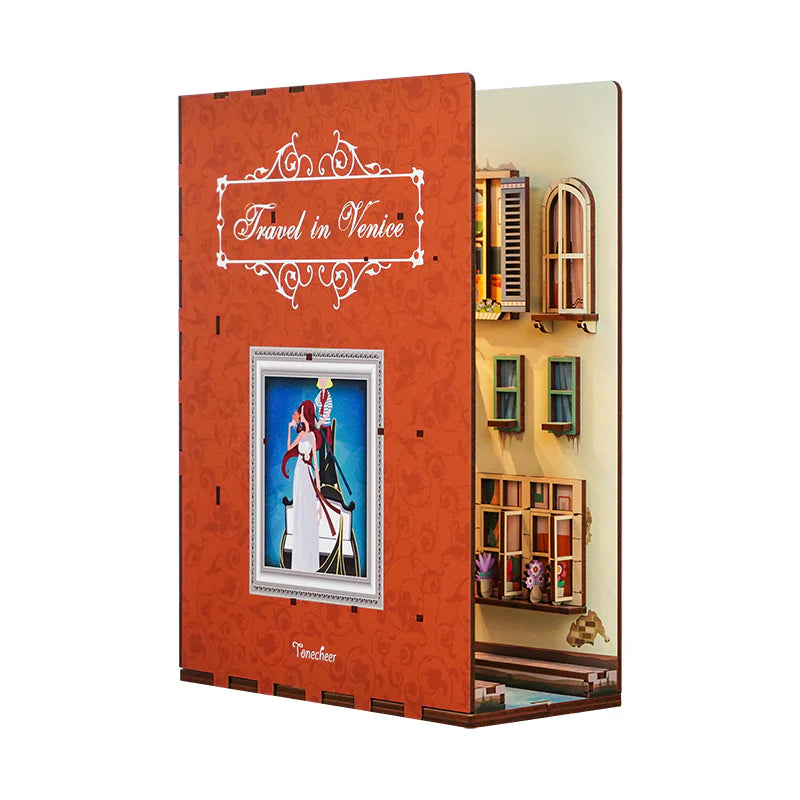 Side view of the 3D wooden book nook puzzle. One side looks like the cover oif a book while the center has a 3D miniature street scene.