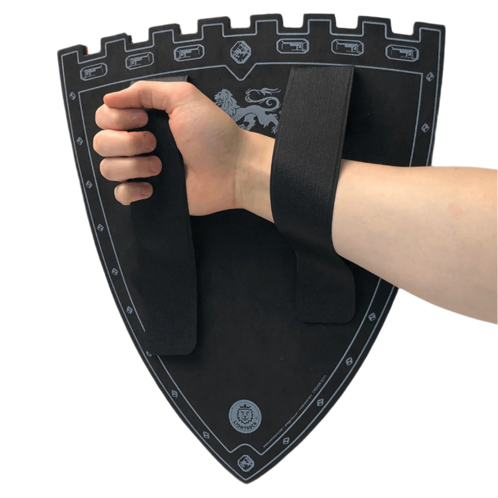 Back side of the Triple Lion King Small Foam Shield with a kids arm through the two straps to hold the shield on. 