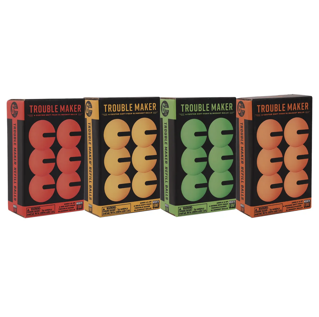 Four boxes with pictures of the specially made Trouble Maker Slingshot balls. Each box has colorful graphics and lettering based on what color the balls are. The colors are red, yellow, range and green. 