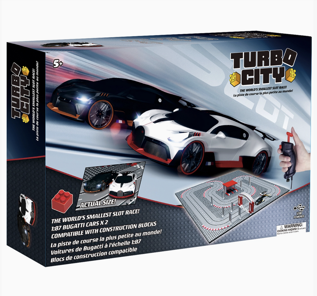 A gray colored box with picture of a black and a white cars racing along the slot track. 