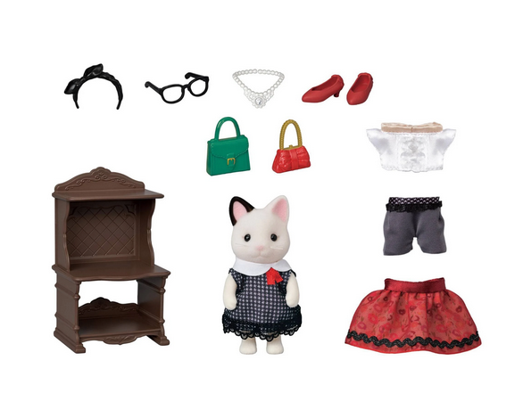 The tuxedo Calico Critters doll, in a navy gingham dress, also showing a red brocade skirt, a pair of gray pants, one red purse, one green purse, red shoes, pearls, glasses and a headband. There is also a cabinet to hold all the accessories. 