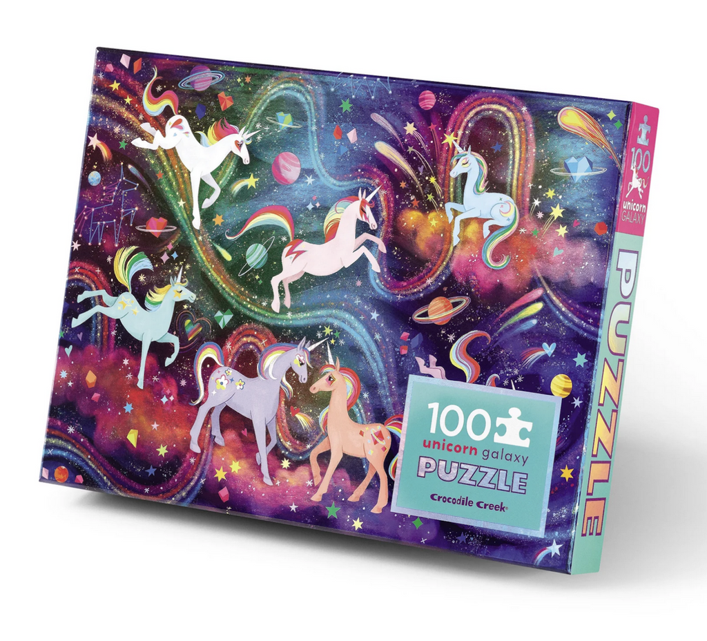 A rectangular shaped box covered with colorful unicorns floating on a background of swirling stars and planets. 