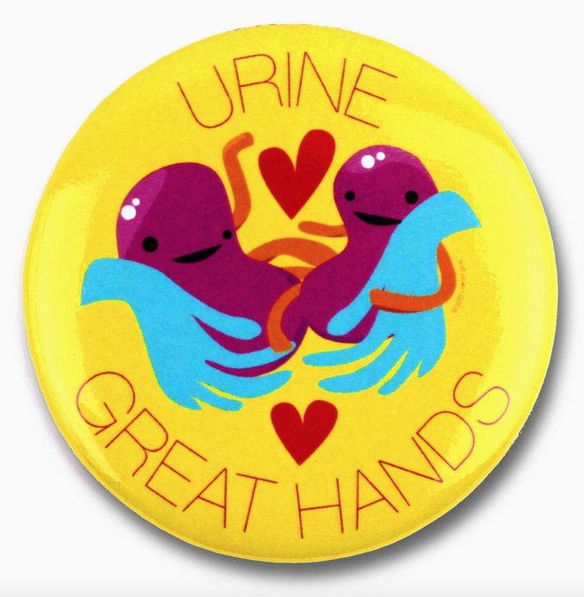Round magnet with yellow background and purple illustrated kidneys that reads "Urine Great Hands"