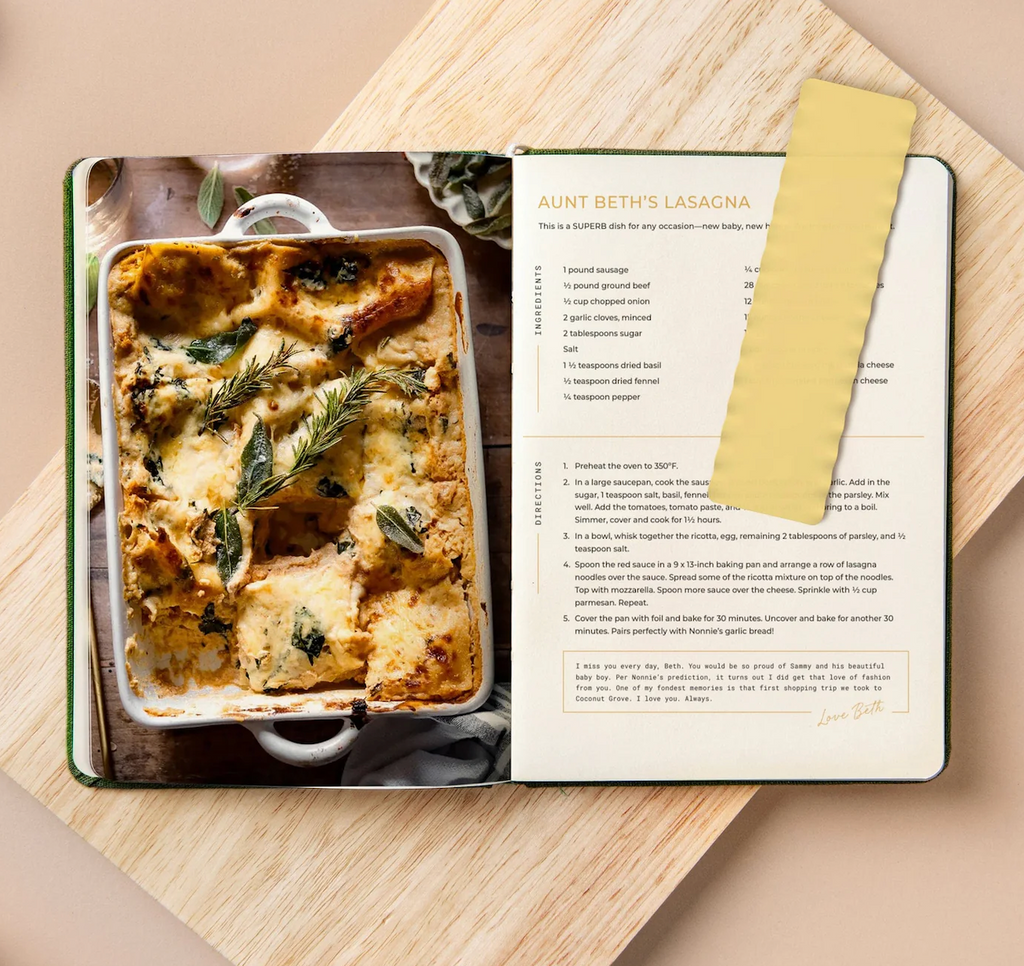 The "Use Your Noodle" bookmark that is shaped like a lasagna noodle holding the page in a cookbook. 