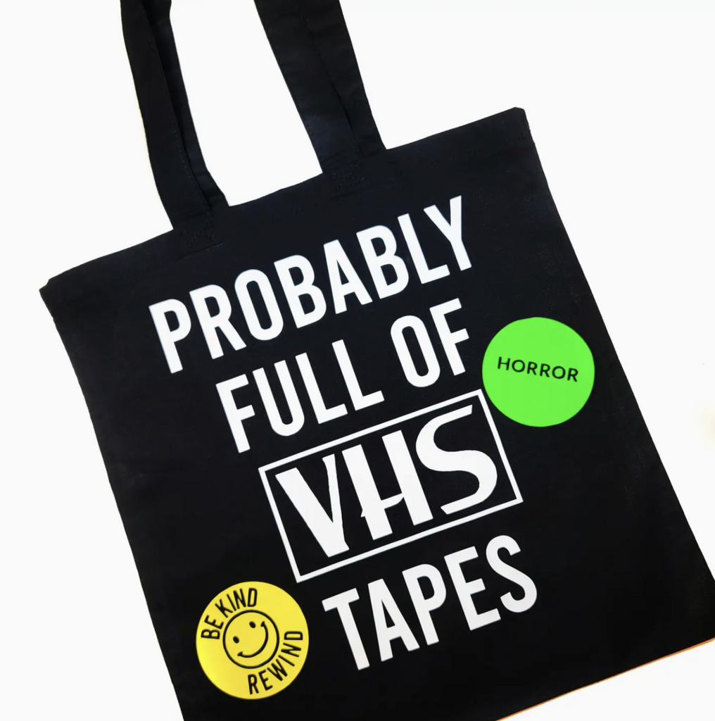 Black cotton tote back with white lettering that reads "Probably Full of VHS Tapes" 