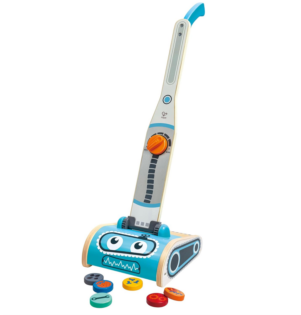 The toy vacuum with robot face and toy rubbish. 