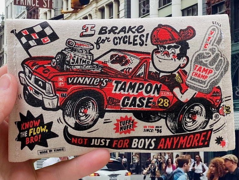 The back of Vinnie's Tampon Case with illustration of Vinnie in a hot rod and it reads " I brake for cycles"