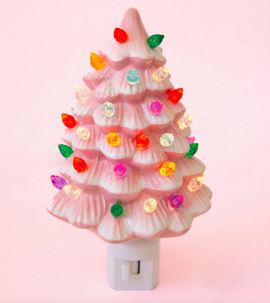 Decorative pink Christmas tree night light with colorful bulbs. 