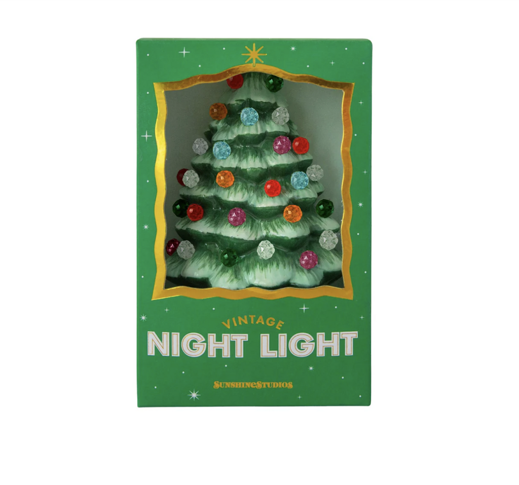 Ceramic Christmas tree shaped night light with brightly colored beads at the end of the branches. The night light is packaged in a green bx with an open "window" at the front of the box. 