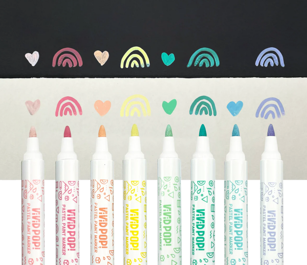 All eight if the Vivid Pop! Pastel Paint Markers written on white and black paper to show the color. 