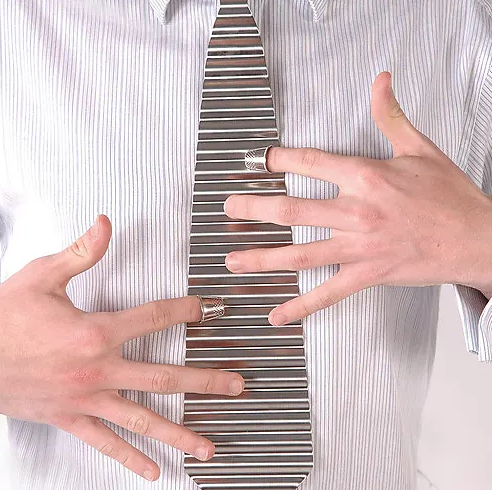 Person in a striped shirt wearing a metal tie and playing it with two thimbles.