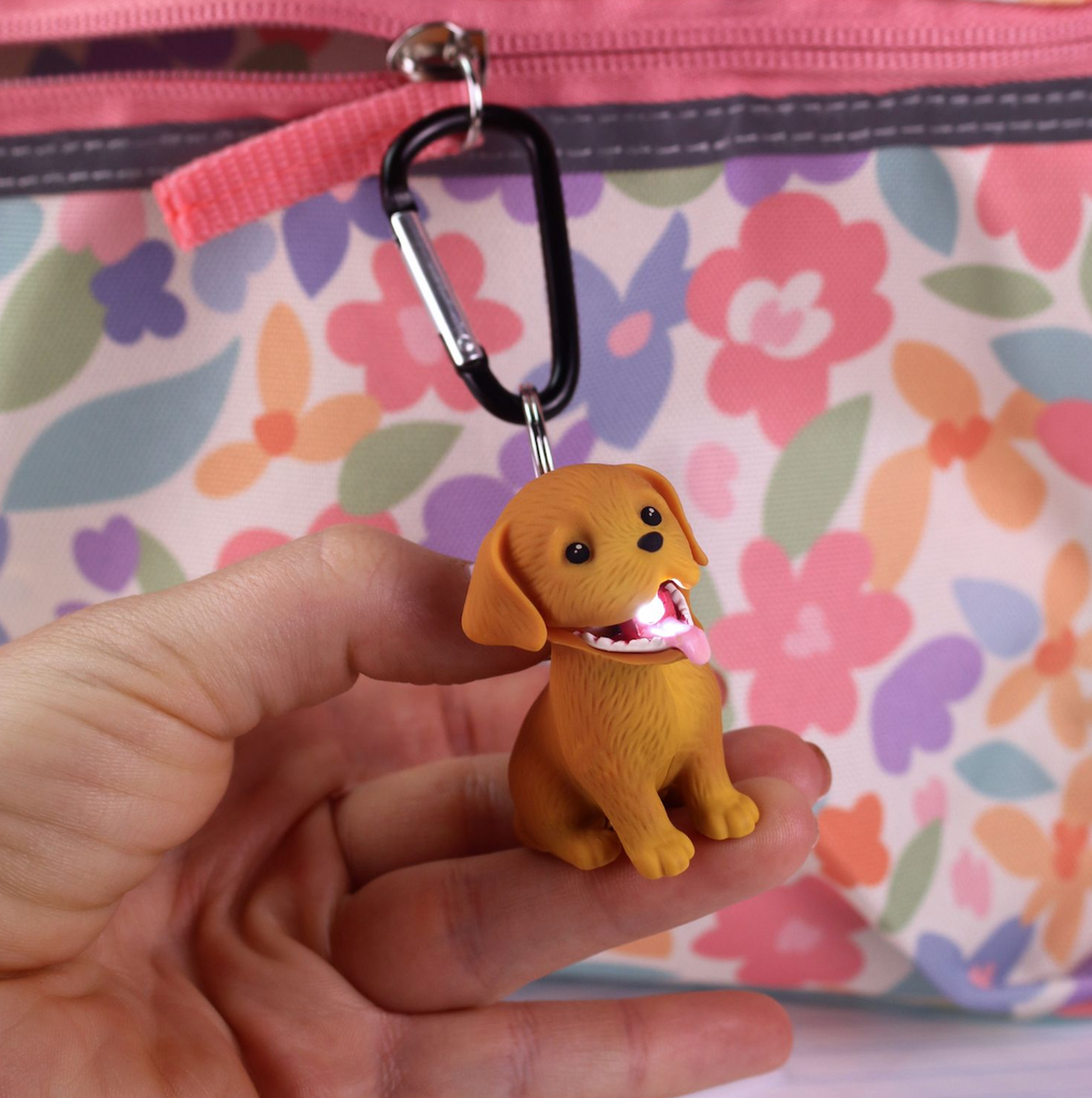 The Retreiver Wildlight attached to a backpack and illuminated. 