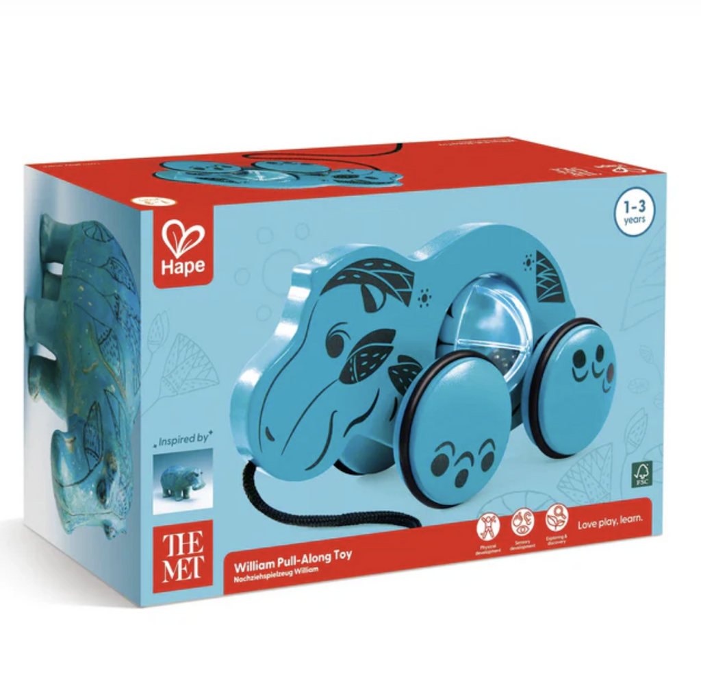 Blue box with red highlights that also has a close up picture of William  the blue hippo wooden pull along toy. 