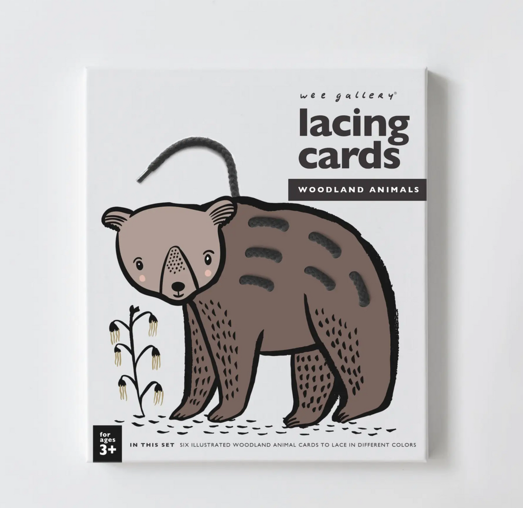 Cover of the box for the Woodland Animal Lacing Cards with an illustrated drawing of a bear with a brown lace woven through it's back. With black lettering on a white background. 